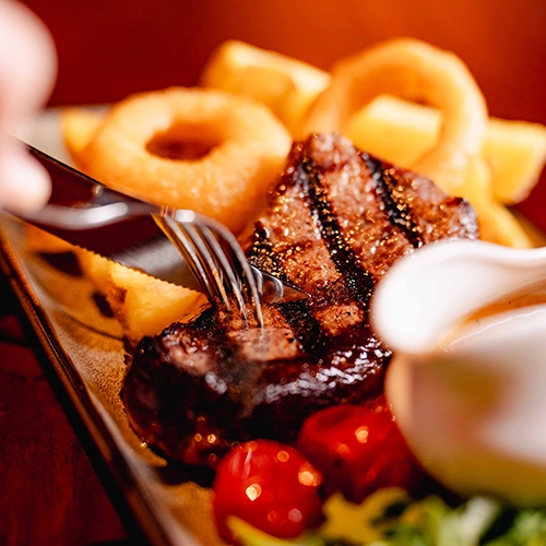 Steak and Gammon served with Onion Rings & Chips